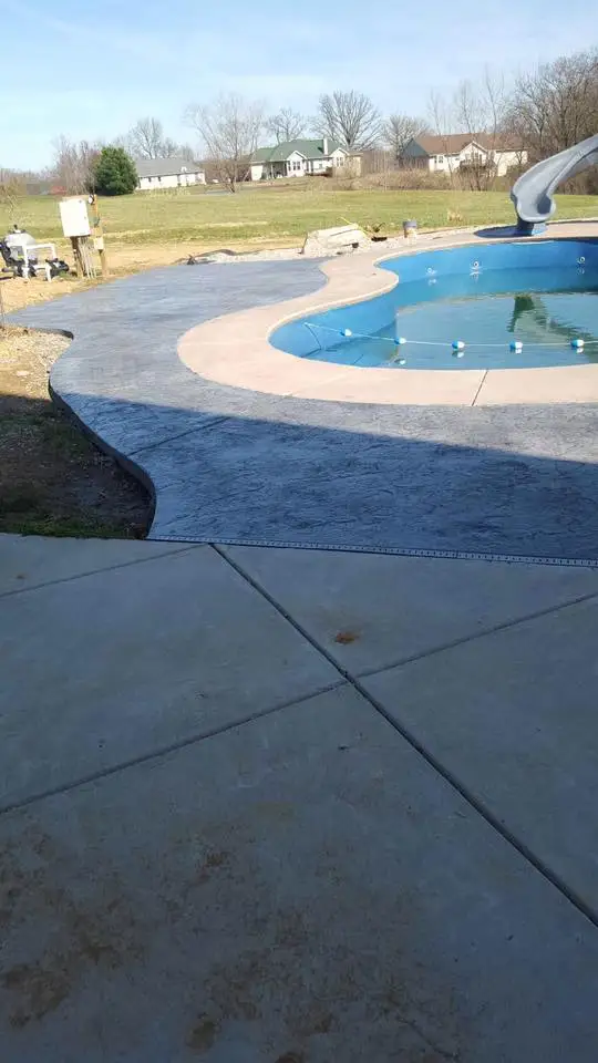 Stamped slate-pattern concrete pool surround in Edwardsville